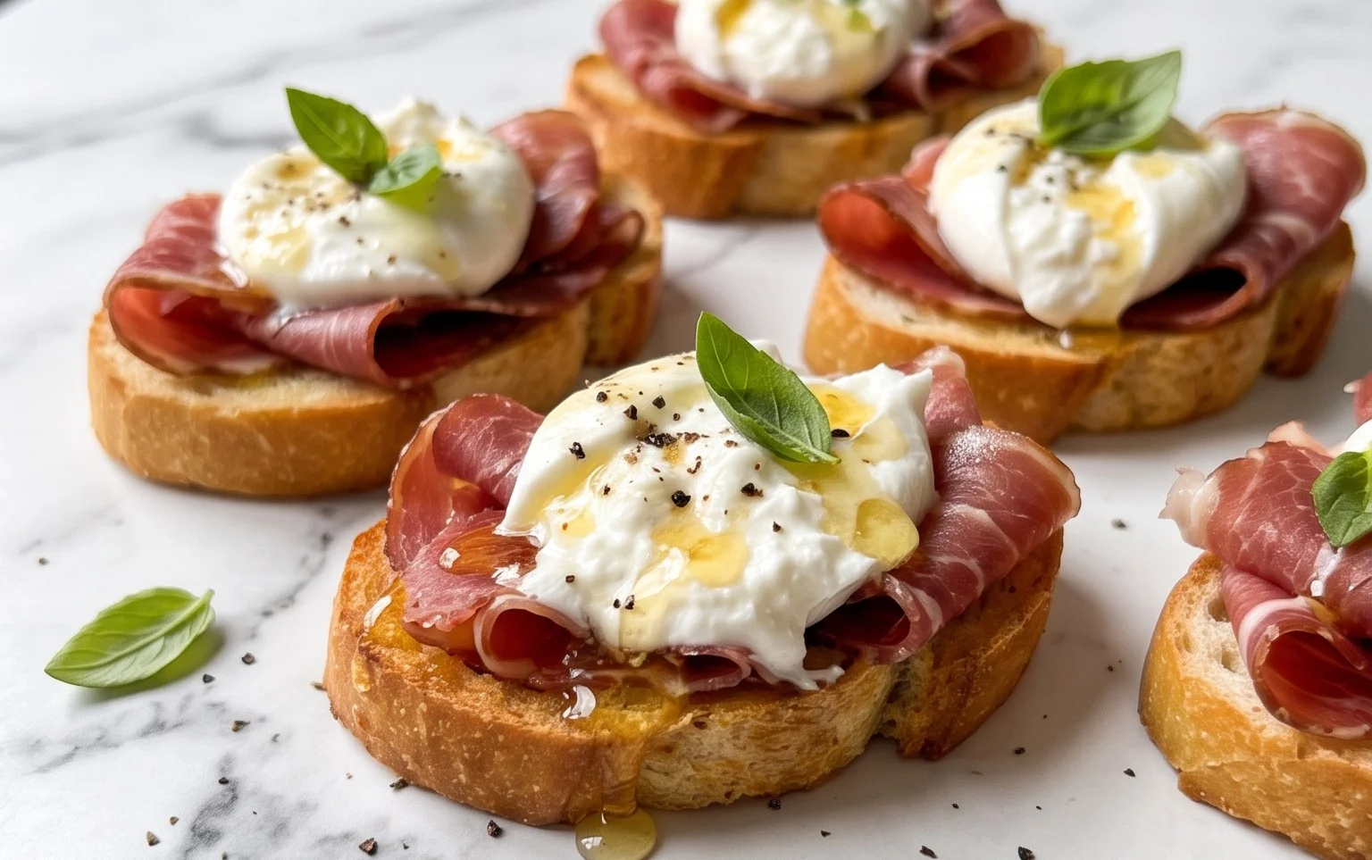 Beef Prosciutto Crostini with Burrata and Lemon Honey Drizzle